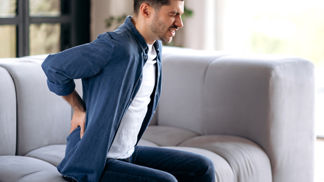 pateint with back pain needing chiropractor in New Braunfels