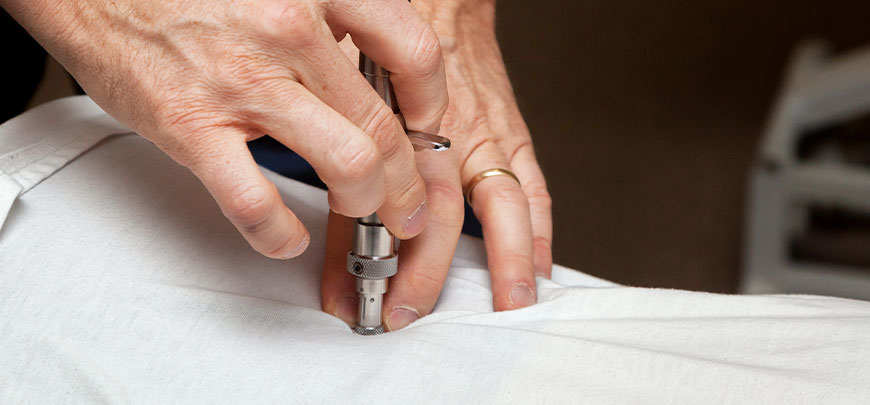 patient receiving activator methods technique in New Braunfels for auto accident injury relief