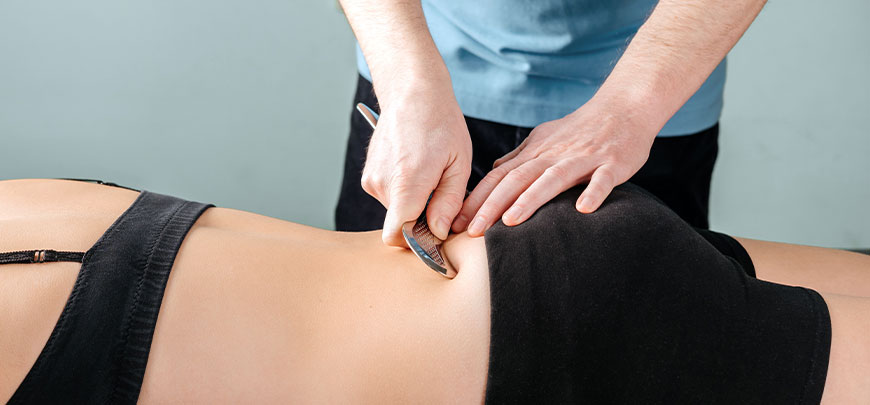 patient receiving graston technique in New Braunfels for auto accident injury relief
